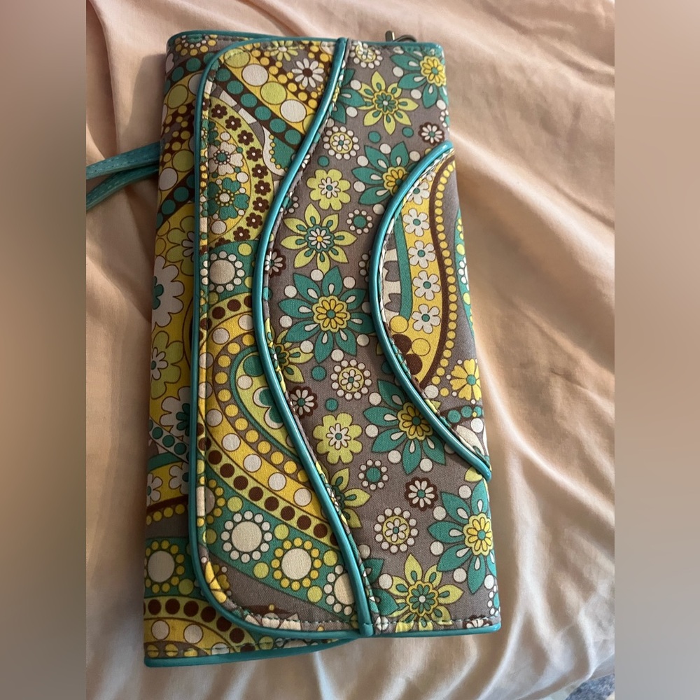 Vera Bradley clutch purse with hand strap.